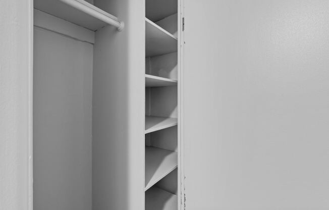 A white shelving unit with several shelves.
