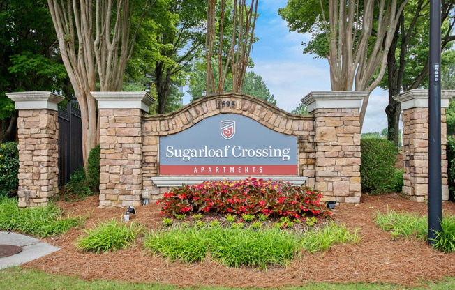 monument sign and landscaping  at Sugarloaf Crossing Apartments, Lawrenceville GA 30046