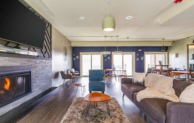 A living room with a fireplace and a couch.