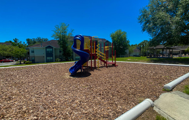 Outdoor Playground equipped with a slide, monkey bars, and latter