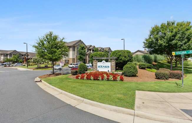 A street view of a residential area with a sign that reads "YOSEMA".