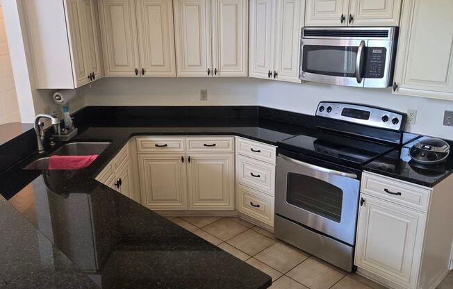 Beautiful 4 Bed / 2 Bath Single-Family Home with Fenced Yard & Screened Patio