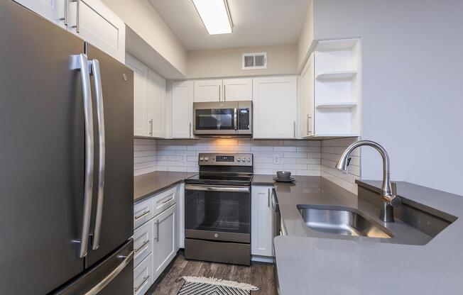 a stainless steel refrigerator in a kitchen