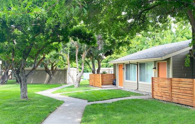 a house with a sidewalk leading to the front door at Park View Apartments, Wenatchee