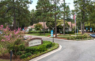 A sign that says Lake in the Pines is in front of a building.
