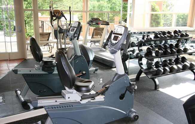 a gym with weights and cardio equipment in it