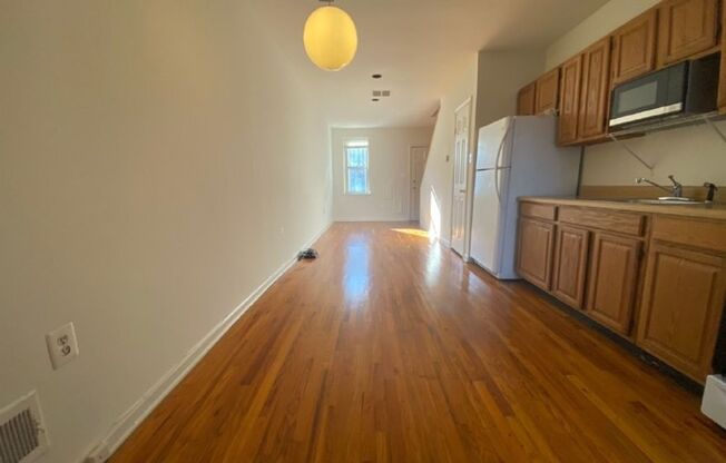 A charming two bedroom one and one half  bath row house located just off New Jersey Ave in the Shaw Neighborhood!