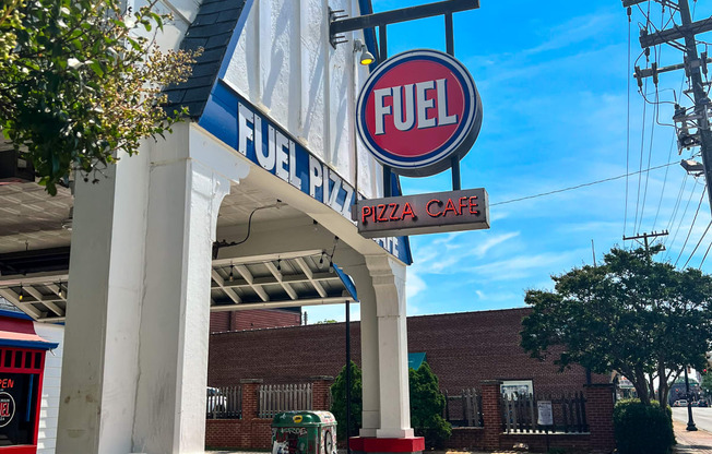 a fuel gas station with a fuel sign on the side of a building