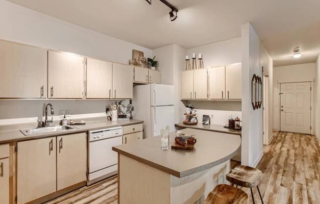 Apartments for Rent in Fairview - Fully Equipped Well Lit Kitchen with Wood Flooring and Island.