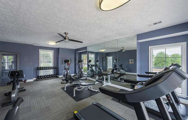 the gym at the enclave at deerwood apartments