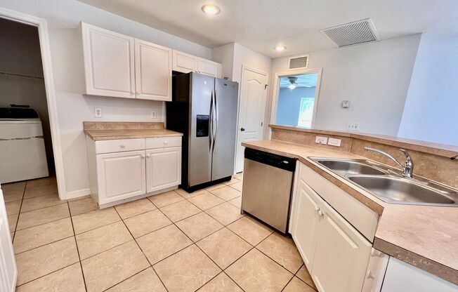 Charming 3BR Home with 2-Car Garage & Lawn Care Included in Lehigh Acres!