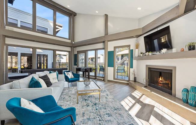 Community Clubhouse with Lounge Furniture and Fireplace at Seven Lakes at Carrollwood Apartments in Tampa, FL.