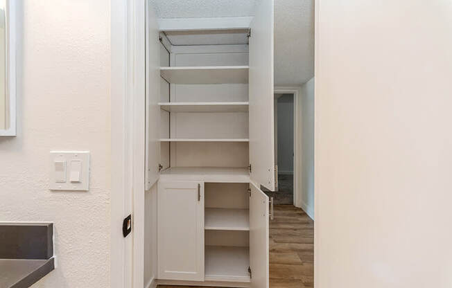 Model Bathroom Shelves at Palmilla Apartments located in San Diego, CA.