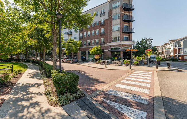 a city street with a building and a crosswalk