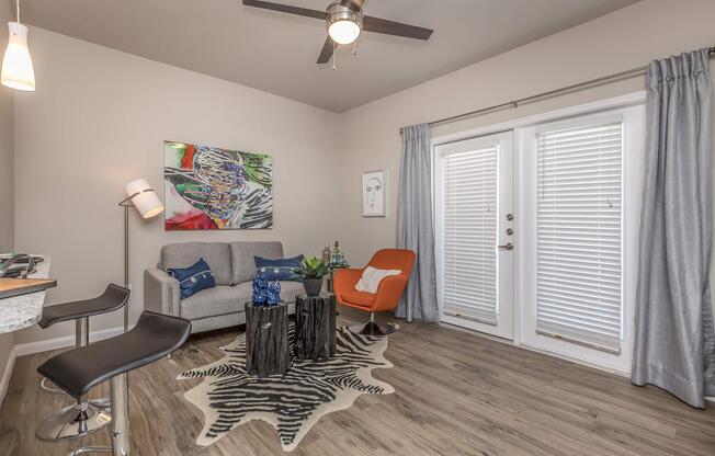 a living room filled with furniture and a window