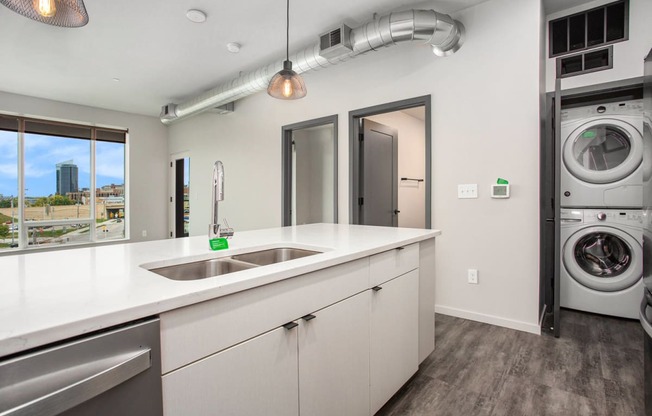 234 Market Apartments In Grand Rapids, MI With Renovated Kitchens featuring a quartz countertop island