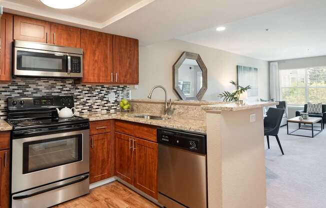 a kitchen with stainless steel appliances and a counter top
