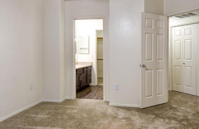 Ingleside Apartments Bedroom with wall to wall carpet and attached bathroom