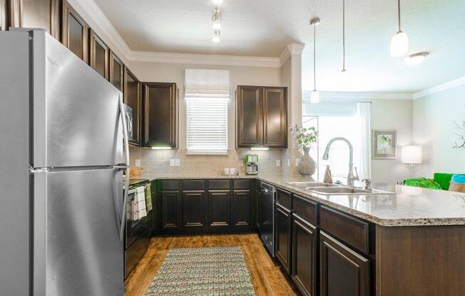 Kitchen With Double Door Refrigerators at Berkshire Woodland, Conroe, TX, 77384
