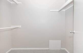 A white door is on the right side of a room.