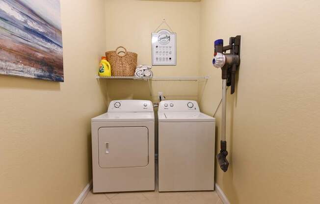 Two washing machines in a small room.