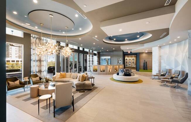 a large lobby with couches and chairs and a table