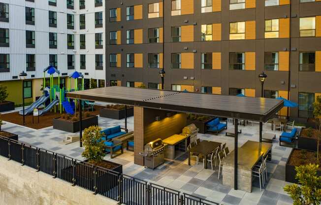 Aerial view of courtyard with covered picnic seatings and bbq grills at POLARIS AT SEATAC, SEATAC, 98188