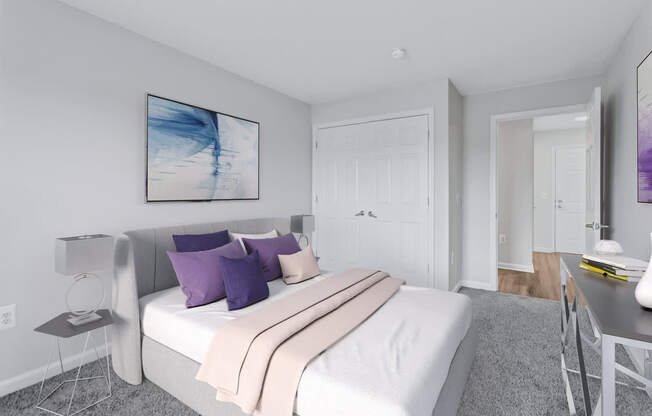 a bedroom with a white bed and purple pillows