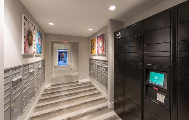 a hallway with gray walls and a striped rug
