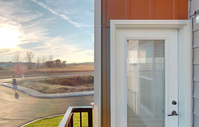 the view from the front door of a home overlooking a parking lot