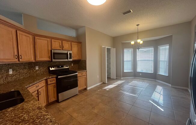 Updated Single family 3 / 2 with Screened in Patio!