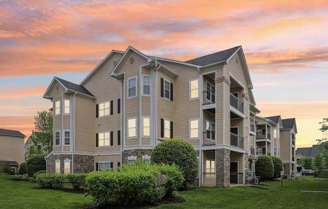 A large apartment complex with multiple buildings and green lawns.