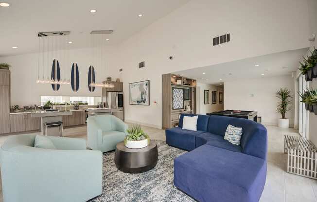 a living room filled with furniture and a large window  at Laguna Gardens Apts., Laguna Niguel, CA