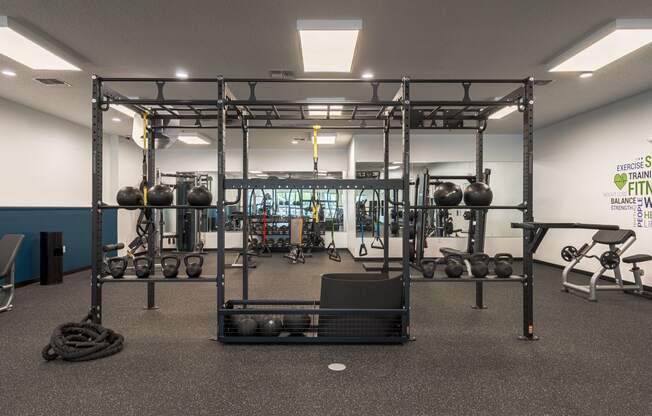 a view of the weights area in the gym