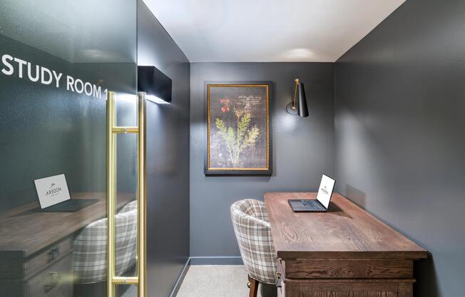 A private study room at Modera University Park, offering a quiet, design-forward setting for focused work and productivity.