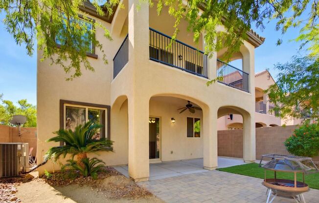 Spacious 2-Story Home w/ Two Balconies, Granite Island Kitchen & Turf Backyard – SW Las Vegas