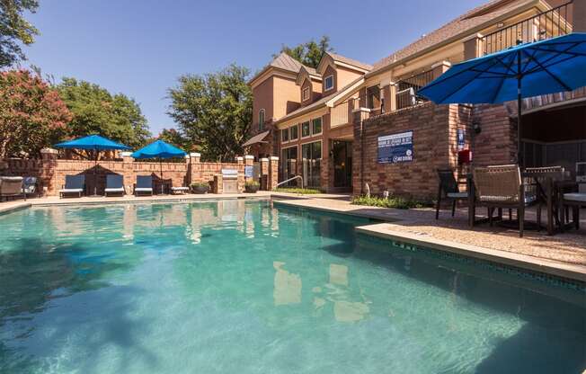 This is a photo of the pool area at The Brownstones Townhome Apartments in Dallas, TX.
