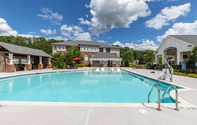 swimming pool with apartment building in the background