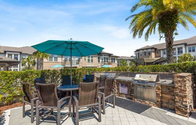 Patio with a Grill and Table at The Loree, Jacksonville, FL, 32256