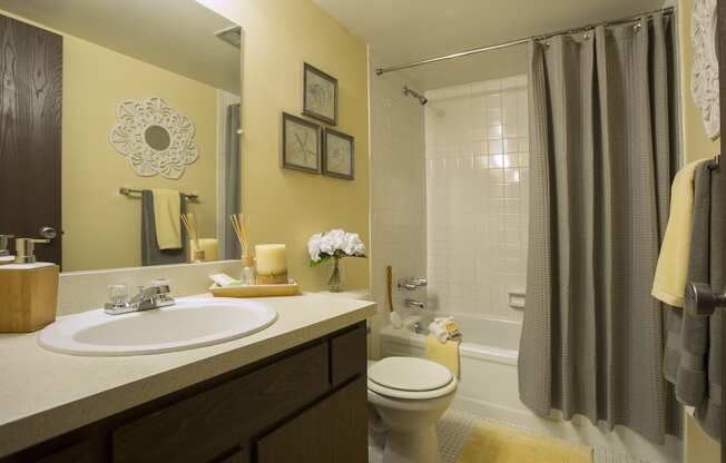 Bathroom with ceramic tile bath walls at Westwood Village Apartments, Westland 48185