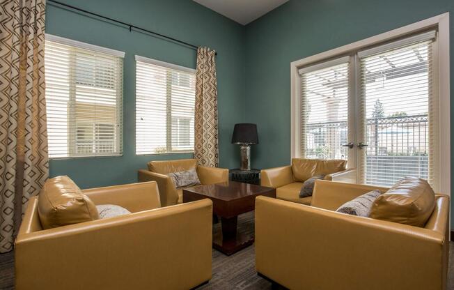 a living room filled with furniture and a large window