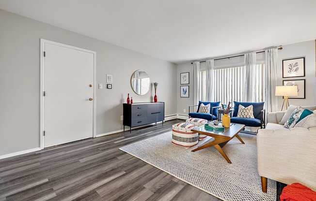 spacious living room with couch and coffee table at the adelaide apartments