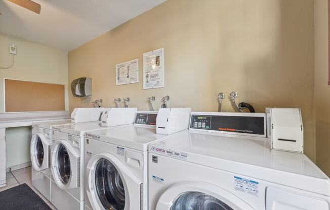 washing machines and dryers in the laundry room of a home