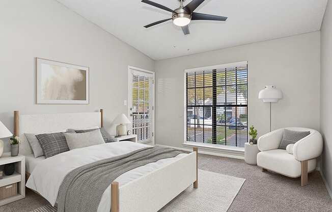 Model Bedroom with Carpet and Window View at Grand Pavilion Apartments in Tampa, FL.