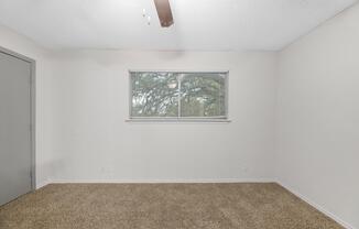 a bedroom with a bed and a mirror
