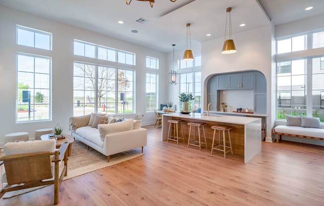 a living room with white walls and hardwood floors