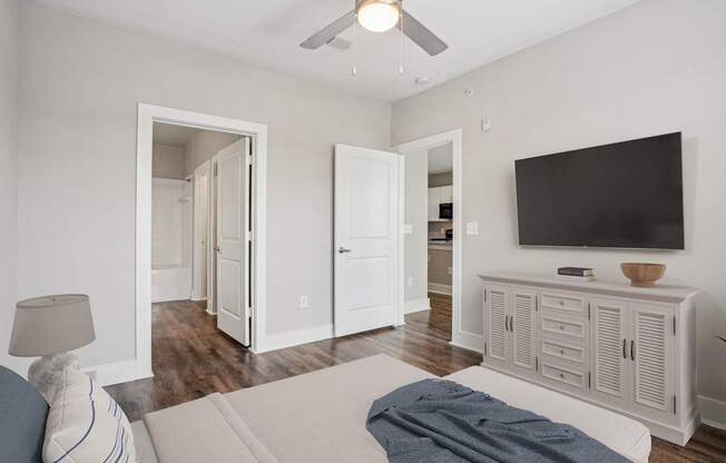A living room with a television and a couch.