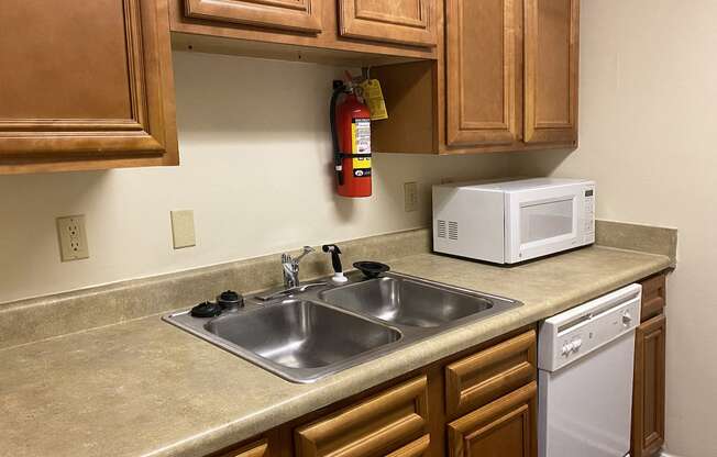 stainless steel sink and fire extinguisher in kitchen