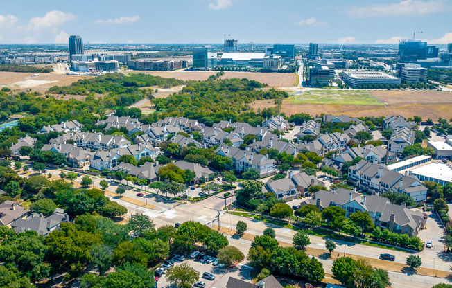 an aerial view of a neighborhood with houses and trees