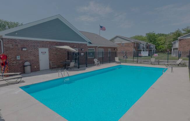 our swimming pool is in front of our building at our apartments in the colony